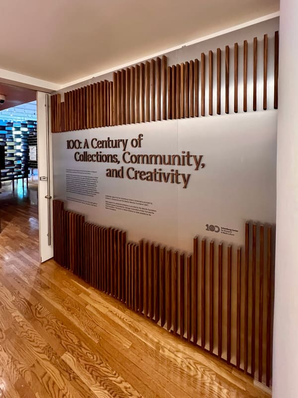 Curved Walnut Exhibition Shelving for the Schomburg Center