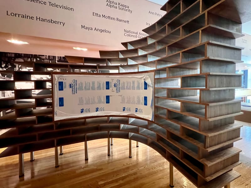 Curved Walnut Exhibition Shelving for the Schomburg Center