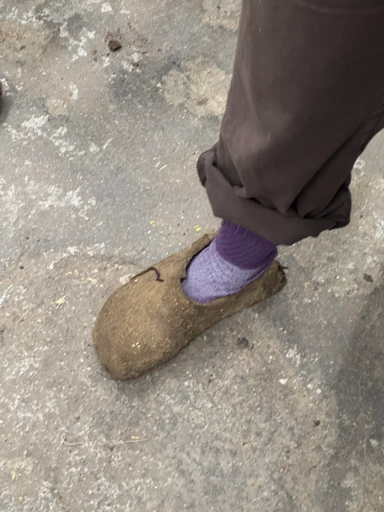 An early dirt clog prototype being worn in the shop