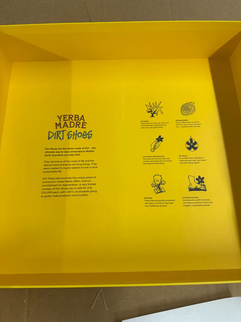The printed interior of the yellow Dirt Shoes box lid