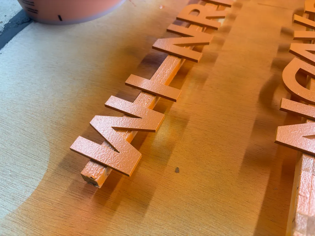Dimensional letters painted orange for the pharmacy signage