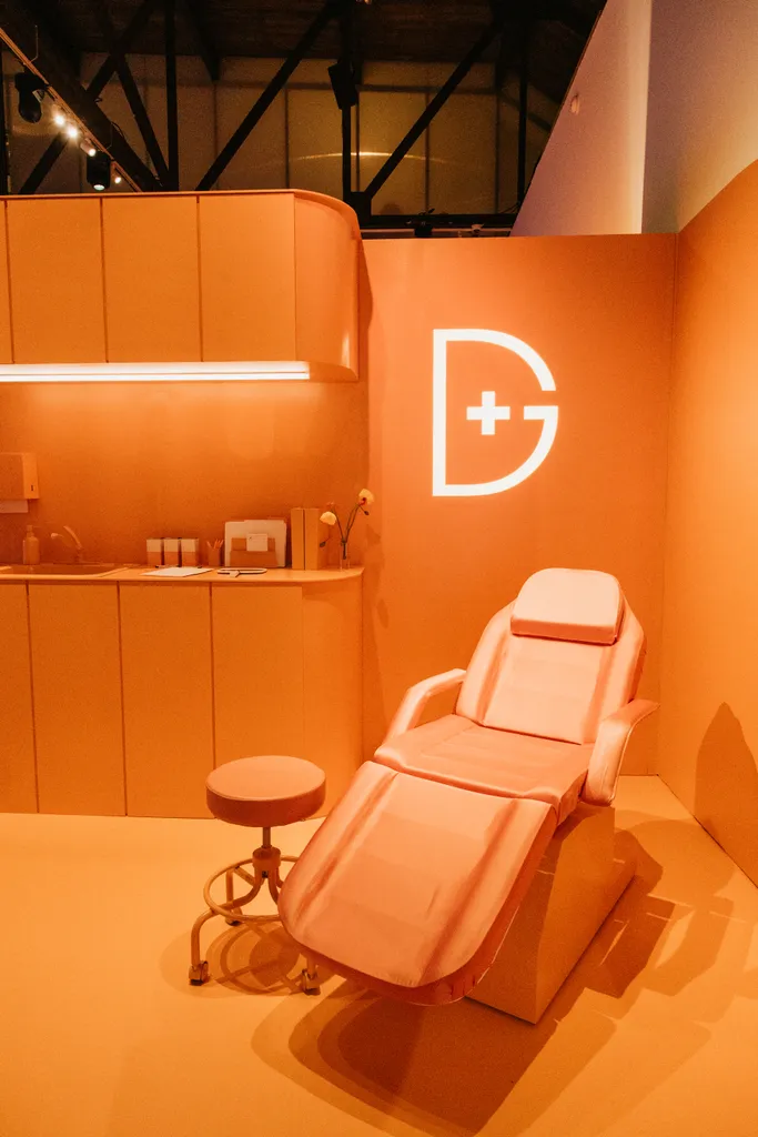 Exam chair and stool finished to match the orange wall