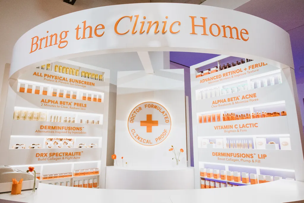 The finished “Bring the Clinic Home” pharmacy booth with lit product shelving and curved front counter