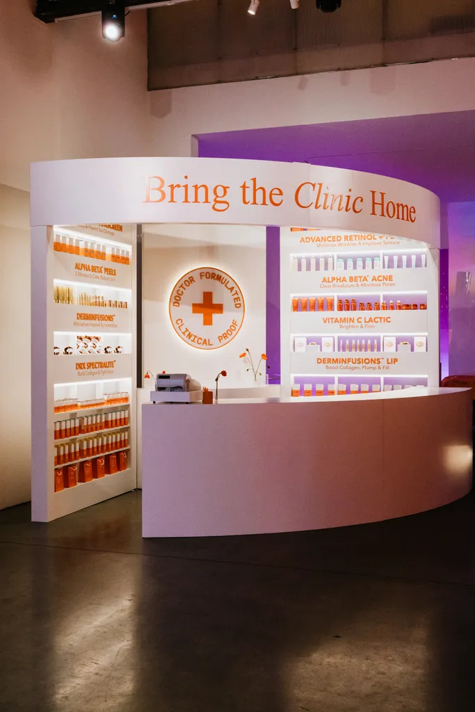 Side view of the pharmacy booth, its curved header and the round “Doctor Formulated” sign