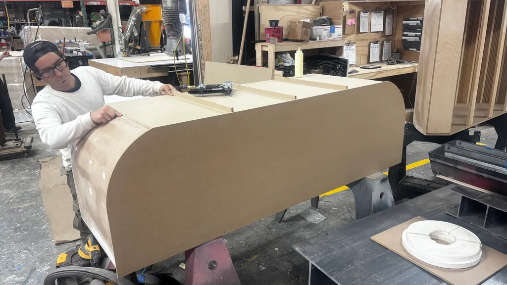 Laminating the curved front counter in the shop