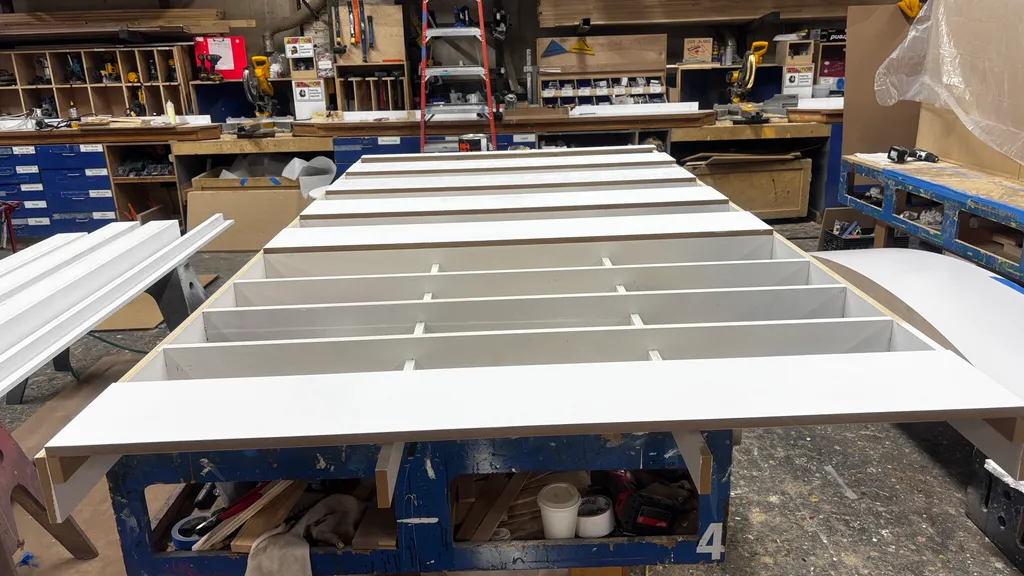 Pharmacy shelving units assembled and painted white in the shop