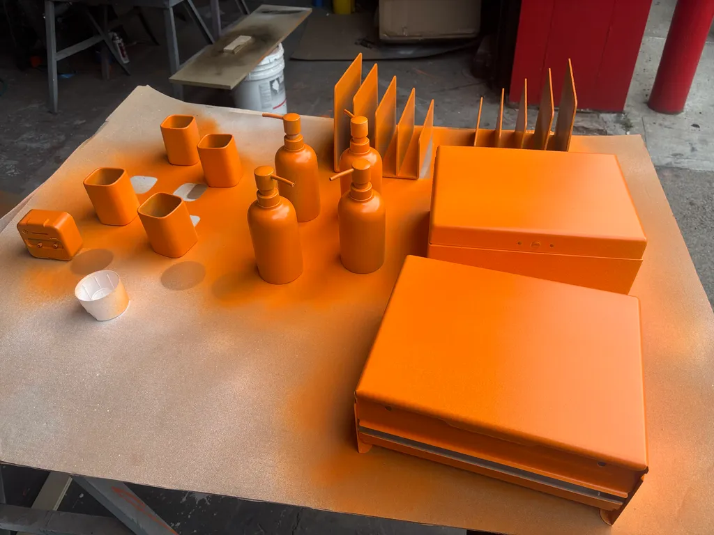 Client-supplied props spray-painted orange in the shop