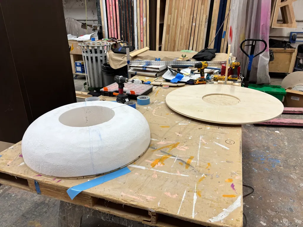 A CNC-cut EPS foam donut on the shop bench before hard coat