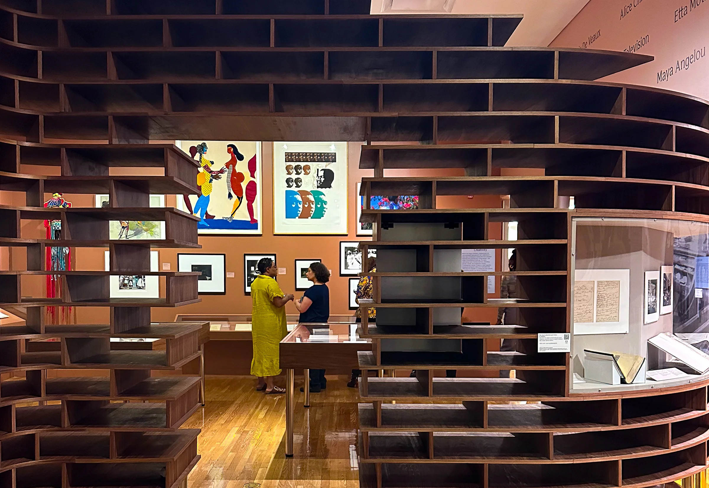 Walnut exhibition fixtures for the Schomburg Center's centennial