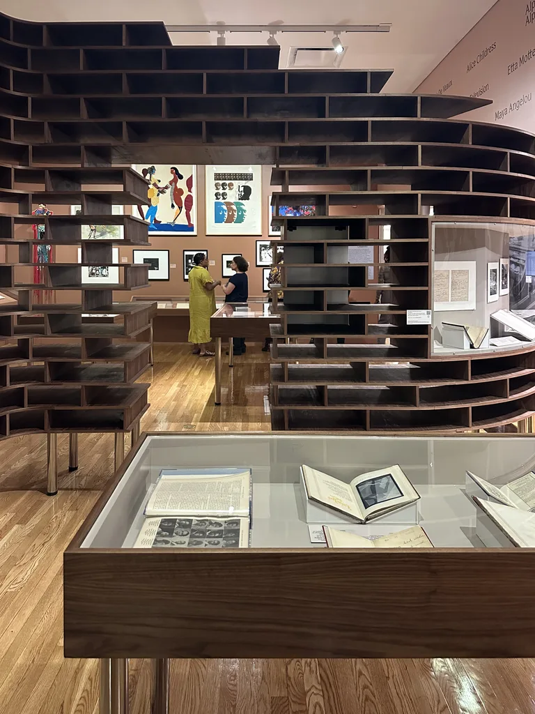 Walnut display case holding archival books
