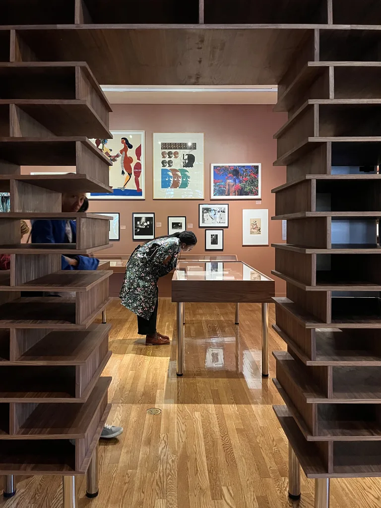 View through a walnut portal into the gallery
