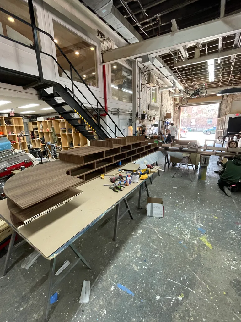 Walnut shelf parts laid out in the shop before assembly